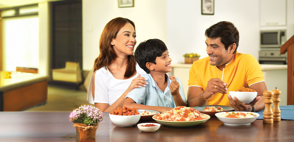 Family having a delicious sausages dishes